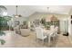 Bright dining room with a large table and access to the back patio at 1928 E View Dr, Sun City Center, FL 33573