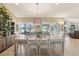 Spacious dining area with large windows and a view of the lake at 1928 E View Dr, Sun City Center, FL 33573