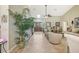 Elegant entryway with tile floors and large potted plants at 1928 E View Dr, Sun City Center, FL 33573