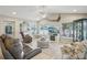 Relaxing Gathering room with lake view, comfortable seating, and large TV at 1928 E View Dr, Sun City Center, FL 33573