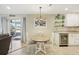 Updated kitchen with white cabinets, granite counters, and stainless steel appliances at 1928 E View Dr, Sun City Center, FL 33573