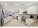 Modern kitchen with stainless steel appliances and granite countertops at 1928 E View Dr, Sun City Center, FL 33573