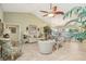 Bright living room with vaulted ceiling, neutral color palette and comfortable seating at 1928 E View Dr, Sun City Center, FL 33573