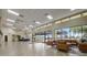 Community building lobby with comfortable seating and large windows at 1928 E View Dr, Sun City Center, FL 33573