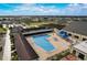 Community pool with surrounding patio and lounge seating at 1928 E View Dr, Sun City Center, FL 33573