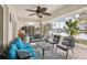 Enjoyable screened patio with comfortable seating and lake view at 1928 E View Dr, Sun City Center, FL 33573