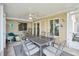 Relaxing screened patio with table and chairs, overlooking the lake at 1928 E View Dr, Sun City Center, FL 33573