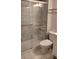 Bathroom with walk-in shower, toilet and vanity at 209 Ne Lincoln N Cir # 109, St Petersburg, FL 33702