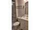 Bathroom with walk-in shower, toilet and vanity at 209 Ne Lincoln N Cir # 109, St Petersburg, FL 33702