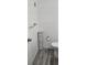 Small bathroom with toilet and linen storage at 209 Ne Lincoln N Cir # 109, St Petersburg, FL 33702