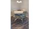 Small dining area with white table and four chairs at 209 Ne Lincoln N Cir # 109, St Petersburg, FL 33702