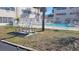 Community picnic table near the refreshing pool at 209 Ne Lincoln N Cir # 109, St Petersburg, FL 33702