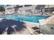 Inviting community pool with ample lounge chairs at 209 Ne Lincoln N Cir # 109, St Petersburg, FL 33702