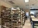 Art studio with shelving units displaying various pottery pieces in progress at 2116 Nantucket Dr # 19, Sun City Center, FL 33573