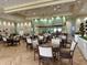 Elegant community dining room with tables, chairs, and stylish decor for a refined dining experience at 2116 Nantucket Dr # 19, Sun City Center, FL 33573