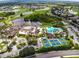 Aerial view showing community pool, clubhouse, and golf course at 2405 New Haven Cir, Sun City Center, FL 33573