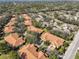 Aerial view of community, showcasing homes and landscaping at 2405 New Haven Cir, Sun City Center, FL 33573