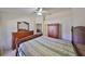 Spacious bedroom with a wooden dresser and large bed at 2405 New Haven Cir, Sun City Center, FL 33573