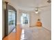Bedroom with light wood dresser and ceiling fan at 2405 New Haven Cir, Sun City Center, FL 33573