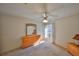 Bedroom with a dresser, ceiling fan and window at 2405 New Haven Cir, Sun City Center, FL 33573
