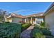 Brick walkway to the front door, nicely landscaped at 2405 New Haven Cir, Sun City Center, FL 33573