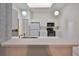 Kitchen features white cabinets, a breakfast bar, and skylights at 2405 New Haven Cir, Sun City Center, FL 33573