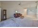 Living room with a leather couch, and ceiling fan at 2405 New Haven Cir, Sun City Center, FL 33573