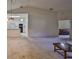 Open living room with kitchen view and access to other rooms at 2405 New Haven Cir, Sun City Center, FL 33573