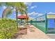 Covered pickleball courts with seating and shaded areas at 2405 New Haven Cir, Sun City Center, FL 33573