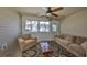 Relaxing sunroom with comfy seating and view to backyard at 2405 New Haven Cir, Sun City Center, FL 33573