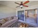 Bright sunroom with comfy seating and access to backyard at 2405 New Haven Cir, Sun City Center, FL 33573