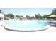 Spacious community pool with shaded lounge areas for a relaxing experience at 2468 Florentine Way # 52, Clearwater, FL 33763