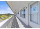 Exterior view of the condo featuring a white balcony with a glimpse of the community at 2468 Florentine Way # 52, Clearwater, FL 33763