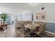 Open-concept living and dining area with modern furnishings, natural light, and a soothing color palette at 2468 Florentine Way # 52, Clearwater, FL 33763