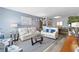 Comfortable living room featuring contemporary decor, soft lighting, and gray laminate flooring at 2468 Florentine Way # 52, Clearwater, FL 33763