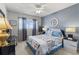 Charming bedroom featuring a patterned bed, soft lighting, and a serene atmosphere at 2468 Florentine Way # 52, Clearwater, FL 33763