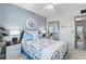 Stylish main bedroom featuring a patterned comforter, mirrored closet, and decorative wall art at 2468 Florentine Way # 52, Clearwater, FL 33763