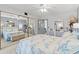 Serene main bedroom with a coral-themed bedspread, mirrored closet doors, and soft natural light at 2468 Florentine Way # 52, Clearwater, FL 33763