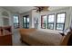 Main bedroom with water views and fireplace at 2757 Via Cipriani # 1114A, Clearwater, FL 33764