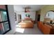 Primary bedroom with large windows and ceiling fan at 2757 Via Cipriani # 1114A, Clearwater, FL 33764