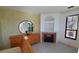 Bright bedroom featuring fireplace and built-in shelving at 2757 Via Cipriani # 1114A, Clearwater, FL 33764