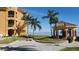 Community waterfront view with gazebo and palm trees at 2757 Via Cipriani # 1114A, Clearwater, FL 33764