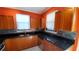Modern kitchen with stainless steel appliances and wood cabinets at 2757 Via Cipriani # 1114A, Clearwater, FL 33764