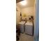 Bright laundry room complete with washer and dryer at 2757 Via Cipriani # 1114A, Clearwater, FL 33764