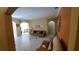 Bright living room with tiled floors, arched doorways, and neutral-toned furniture at 2757 Via Cipriani # 1114A, Clearwater, FL 33764