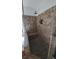 Walk-in shower with tiled walls and built-in seat at 2757 Via Cipriani # 1114A, Clearwater, FL 33764