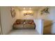 Small sitting area with a couch and artistic wall decor at 2757 Via Cipriani # 1114A, Clearwater, FL 33764