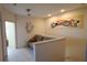 Small sitting area with a couch and artistic wall decor at 2757 Via Cipriani # 1114A, Clearwater, FL 33764