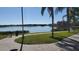 Brick pathway meanders along waterfront with lush landscaping at 2757 Via Cipriani # 1114A, Clearwater, FL 33764