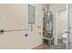 Laundry room with water heater and additional toilet at 2765 57Th N St, St Petersburg, FL 33710